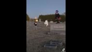 Mom and two kids dancing in the graveyard (Image Via YouTube/Pegasus)